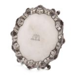 A George III silver waiter, by Richard Rugg, London 1764, circular form, shell and scroll border, on