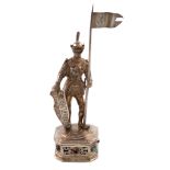 A German silver-gilt model of a knight, modelled in a standing position holding a lance and