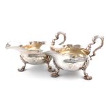 A pair of George II silver sauce boats, by Fuller White, London 1752, oval form, leaf capped