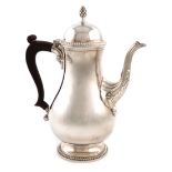 A modern silver coffee pot, by Barker Ellis Silver Co., Birmingham 1965, baluster form, scroll