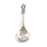 An Edwardian Arts and Crafts silver Apostle spoon, by Edmund Ware, London 1904, fig-shaped bowl, the