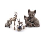 A mixed lot of silver animals, comprising: a model of a lion, London 1982, a sable antelope, and