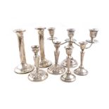 A mixed lot of silver candlesticks, various dates and makers, comprising: a pair of plain