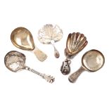 A collection of five antique silver caddy spoons, various dates and makers, including: a George