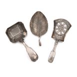 A small mixed lot of thee antique silver caddy spoons, comprising: one of leaf form, by Elizabeth