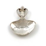 By A. E. Jones, an Arts and Crafts silver caddy spoon, Birmingham 1911, spread heart-shaped bowl,