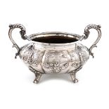 A Victorian two-handled silver sugar bowl, by Robert Hennell, London 1840, lobed circular form, leaf