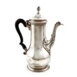 A George III silver coffee pot, possibly by Abraham Portal, London 1765, baluster form, scroll