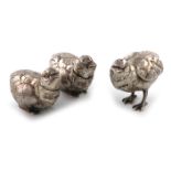 A three-piece novelty silver chick pepper pots, by Neresheimer of Hanau, with import marks for 1925,