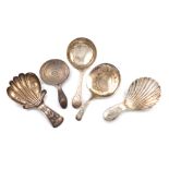 A collection of five antique silver caddy spoons, various dates and makers, including: a George