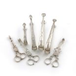A mixed collection of silver sugar tongs and nips, including an Irish provincial pair, by John
