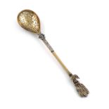 An unusual Victorian silver-gilt sifting spoon in the Turkish manner, by Francis Boone Thomas,