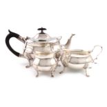 A three-piece Edwardian silver tea set, by William Hutton and Sons, London 1904/5, oval bellied