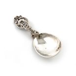 A Norwegian Arts and Crafts silver caddy spoon, by Thune, Oslo, spot-hammered fig-shaped bowl, the