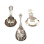 A small collection of three antique Irish silver caddy spoons, one by Samuel Neville, Dublin 1817,