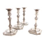 A set of four late-Victorian silver candlesticks, by Hawksworth, Eyre and Company, Sheffield 1899,