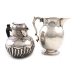 An Edwardian silver jug, by Martin, Hall and Company, Sheffield 1909, baluster form, scroll