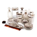 λA mixed lot of silver-mounted dressing table jars and bottles, comprising: a Tiffany scent