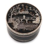 An 18th century silver-mounted lacquered snuff box, circa 1780-1800, circular form, the pull-off