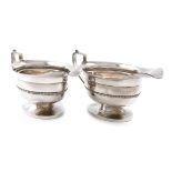 A pair of silver sauce boats, by Duncan & Scobbie, Birmingham 1936, oval form, scroll handle,