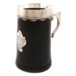 An 18th century silver-mounted leather mug, maker's mark only, that of IP, circa 1750, tapering