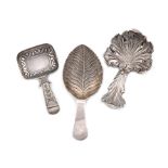 A small collection of three antique silver caddy spoons, comprising: a Victorian one by Wheeler