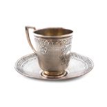 A 19th century Russian silver cup and saucer, assay master Viktor Savinkov, Moscow 1874, tapering