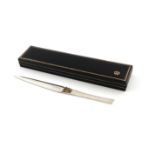 By Stuart Devlin, a modern parcel-gilt silver letter opener, London 1982, tapering form, with a