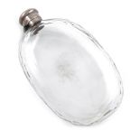 A large Victorian silver-mounted glass spirit flask, maker's mark worn, London 1874, faceted oval