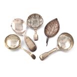 A collection of five antique silver caddy spoons, various dates and makers, including: a George