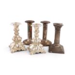 A mixed lot of silver candlesticks, comprising: an Edwardian pair, Birmingham 1904, circular form,