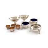 A collection of Irish silver salt cellars, comprising: a matched pair of George III salt cellars,