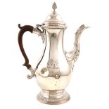 A George III silver coffee pot, by Walter Brind, London 1774, baluster form, scroll handle,