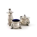 Designed by James Fenton, an Edwardian three-piece silver Art Nouveau condiment set, retailed by