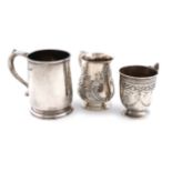 A small collection of three silver mugs, comprising: a George III one, by Thomas James, London 1809,