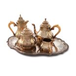 λA 19th century French silver-gilt tea set and tray, by A. Aucoc, Paris circa 1890, lobed square