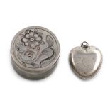 A silver heart-shaped locket, unmarked, probably 18th century, with worn engraved decoration, it