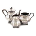 λA three-piece Victorian silver tea set, by George Angell, London 1850/51, panelled baluster form,