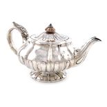 λA George IV silver teapot, by William Eley, London 1824, lobed circular bellied form, the flush