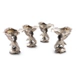 A set of four George III silver salt cellars, by Robert Gainsford, Sheffield 1814, the shell bowl