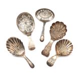 A collection of five antique silver caddy spoons, various dates and makers, including: a William