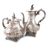 λA Victorian silver coffee pot and tea pot, by William Smily, London 1858, baluster form, embossed