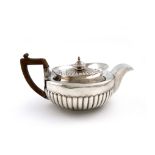 A George III Scottish silver teapot, maker's mark possibly that of James Dempster, Edinburgh 1802,