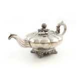 λA William IV Irish silver teapot, by James Fray, Dublin 1837, lobed circular form, scroll handle