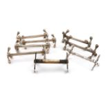 A collection of eight silver knife rests, comprising: a Victorian pair, by Atkin Bros, Sheffield