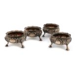 A set of four Victorian silver salt cellars, by Gibson & Langman, London 1896, cauldron form,