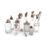 A collection of silver-mounted glass cruet bottles, comprising: four George III/IV silver-mounted