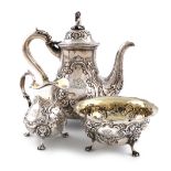 λA three-piece Victorian bachelor's coffee set, by Robert Hennell, London 1852, baluster form,