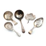 A collection of five antique silver caddy spoons, various dates and makers, including: a George