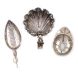 A small collection of three antique silver caddy spoons, comprising: a Victorian one by George